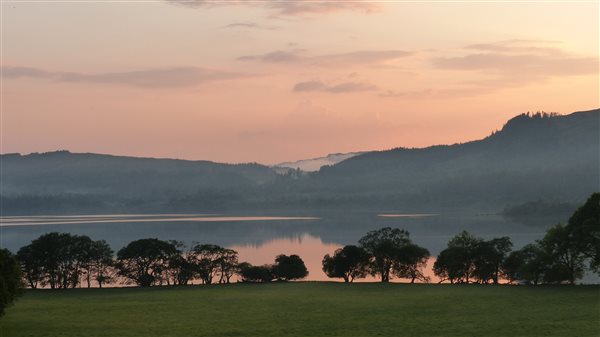 Gentle sunset reflecting on Loch Awe, argyll